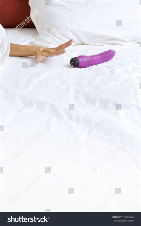 Womans Hand Reaching Dildo Bed Stock Photo Shutterstock