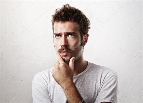 Thoughtful Young Man With Mustache Stock Photo By ©kantver 58418597