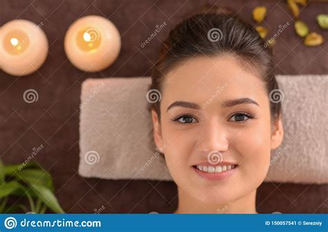 Young Woman Relaxing On Massage Table At Spa Salon Top View Stock