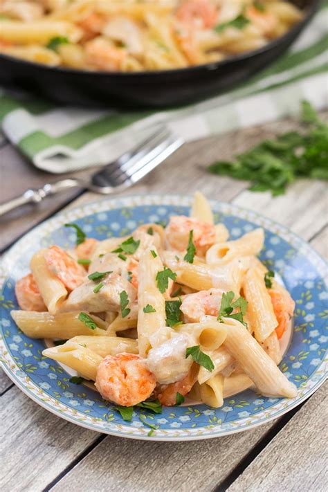 Pan seared garlic shrimp, broccoli and pasta tossed in creamy lightened up garlic alfredo sauce that contains no cream! Chicken and Shrimp Alfredo Pasta | Recipe | Chicken and ...