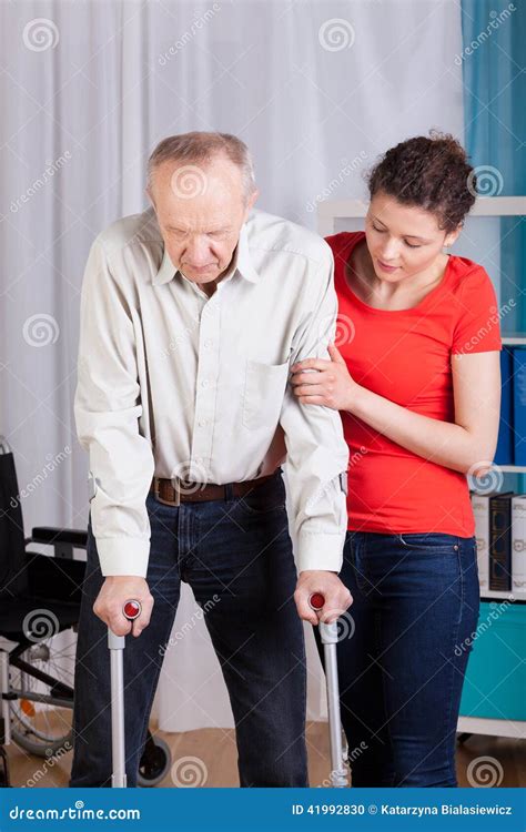Disabled Man Walking On Crutches Stock Photo Image Of Health Mature