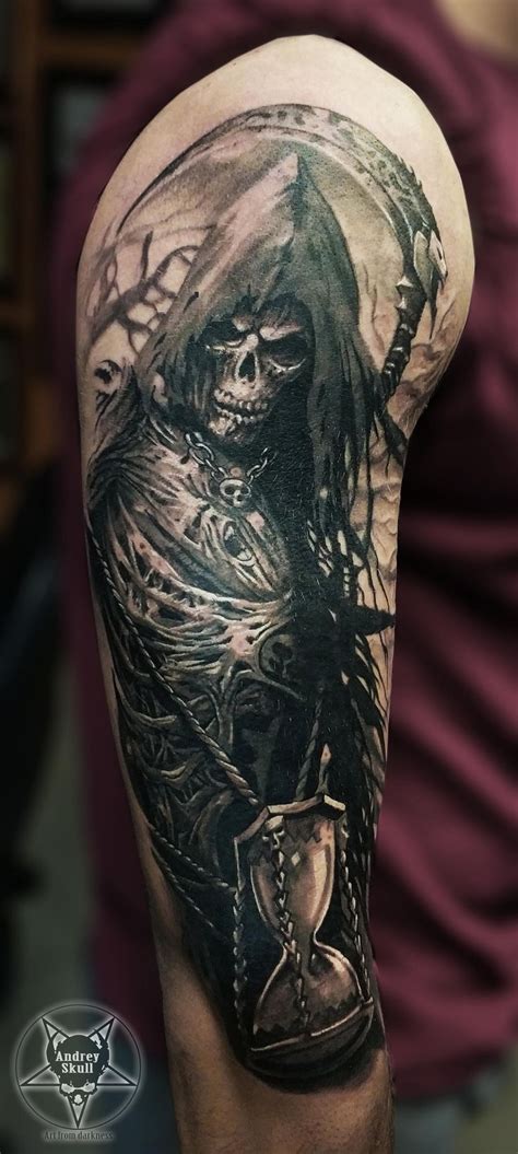 A Mans Arm With A Skeleton And Hourglass Tattoo On The Left Sleeve