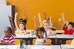 School kids raising hand in classroom - Healthy Schools PA