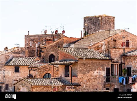 san gimignano italy rooftop with historic old medieval buildings of town village orange stone