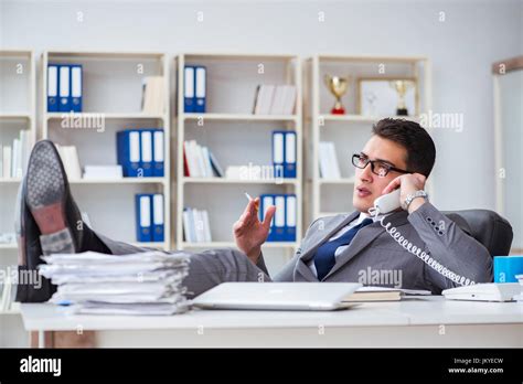 Businessman Smoking In Office At Work Stock Photo Alamy