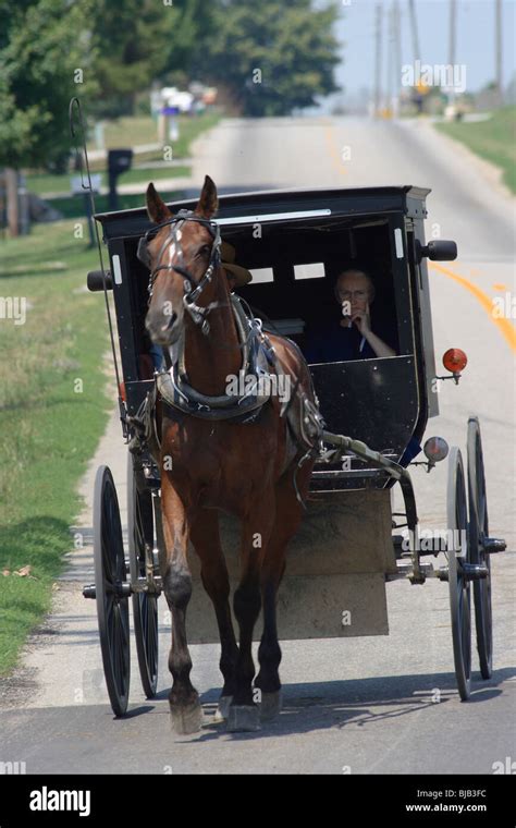 A Horse Drawn Carriage Of Amish People Topeka United States Of