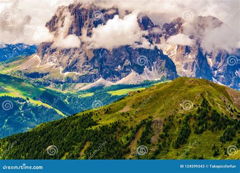 View Of The Beautiful Dolomites Mountain With The Clouds Floating Over