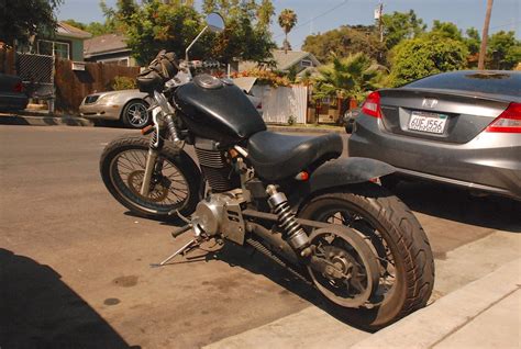 The single 40mm carburetor keeps the bike moving until 120 km/hr at which point acceleration drops to a crawl up to 150 km/hr, if you make it to that speed. suzuki boulevard S40 parked in hollywood