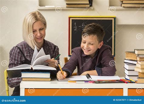 School Tutor With Young Student Helping Stock Image Image Of Help