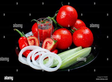 Still Life With Tomatoes Onion Pepper And Cucumbers On A Dark