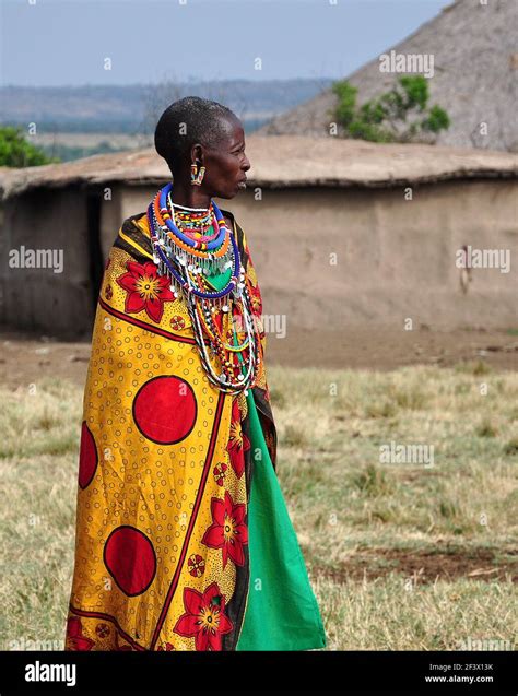 Old Masai Women Wearing Colorful Traditional Clothes In A Masai Village