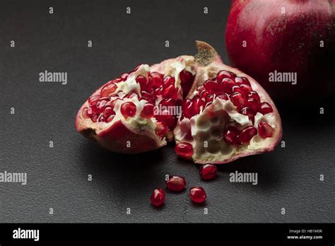 Pomegranate On Black Stock Photo Alamy