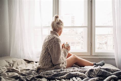 Blonde Woman Drinking Morning Coffee In Bed Del Colaborador De Stocksy Lumina Stocksy