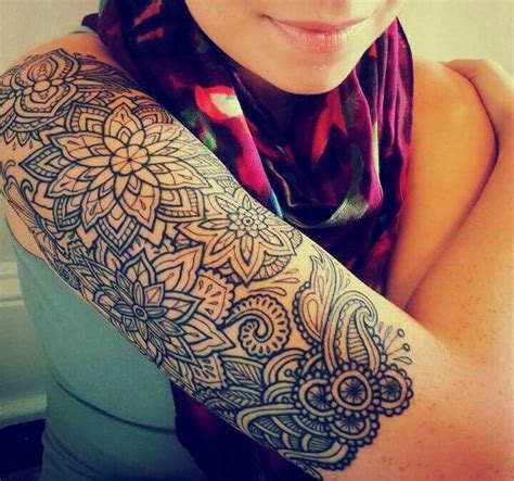 A Woman With A Tattoo On Her Arm