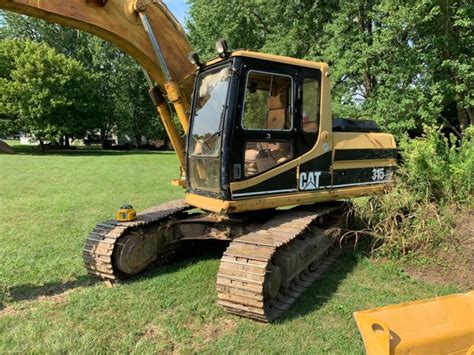 Excavators for every building site. 315 L Cat Excavator With Thumb for sale from United States