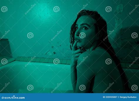 Playful Brunette Posing In A Bathtub Wearing Underwear In The Neon Light Stock Image Image Of