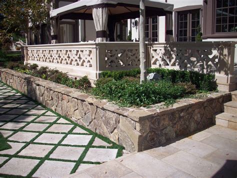 Permeable Pavers And A Handsome Stone Veneer Retaining Wall