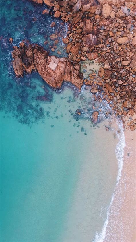 Aerial View Of Rocks Near Body Of Water Iphone 8 Wallpapers Free Download