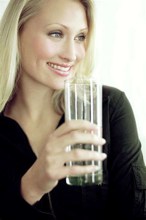 Woman Drinking A Glass Of Water Photograph By Ian Hooton Science Photo Library Fine Art America
