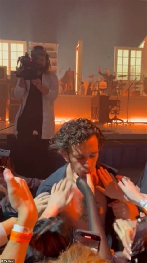 the 1975 s matty healy causes a stir by french kissing fans and sucking on their fingers mid gig