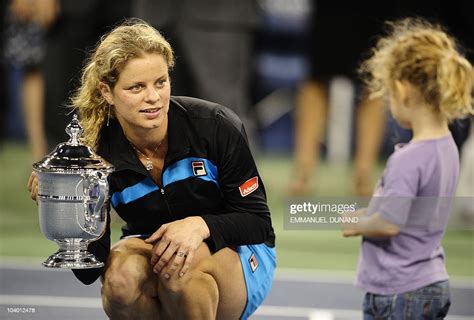 Belgium Tennis Player Kim Clijsters Holds Her Trophy While Talking To