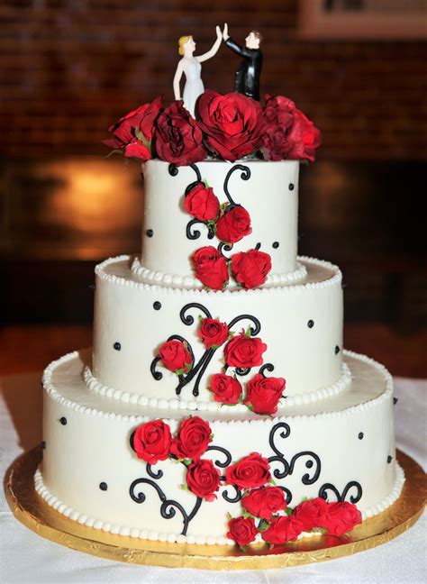 3 Tier Round Wedding Cake With Black Swirl Design And Red Roses With
