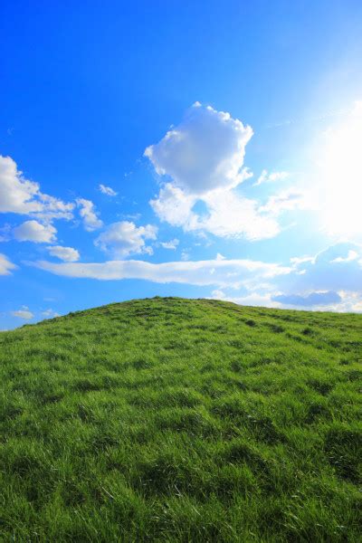 Green Grass Hills Under Midday Sun Stock Photo By ©netfalls 5372225
