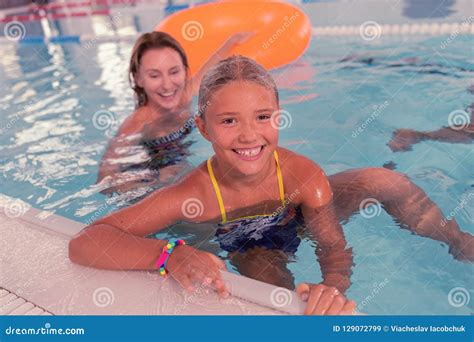 Cheerful Joyful Girl Holding The Edge Of The Pool Stock Image Image