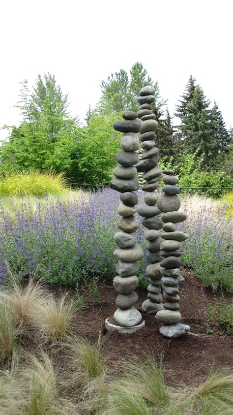 These Rocks Are Stacked Onto A Thing Metal Rod Theyve All Been