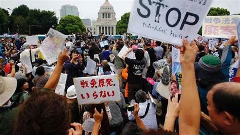 Tens Of Thousands Rally Outside Japanese Parliament To Protest Divisive