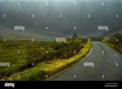 Scenic Single Track Road Through Hills On Isle Of Skye In Scotland