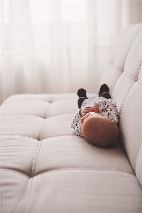 Newborn Baby Sleeping On A Sofa By Stocksy Contributor Lea Csontos