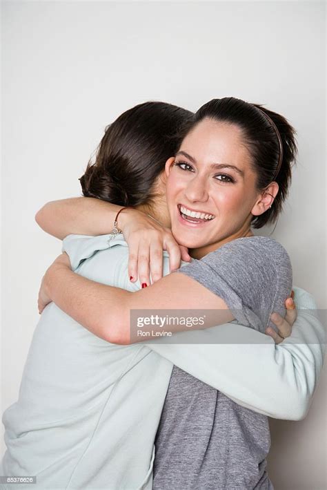 Teenage Female Friends Hugging High Res Stock Photo Getty Images