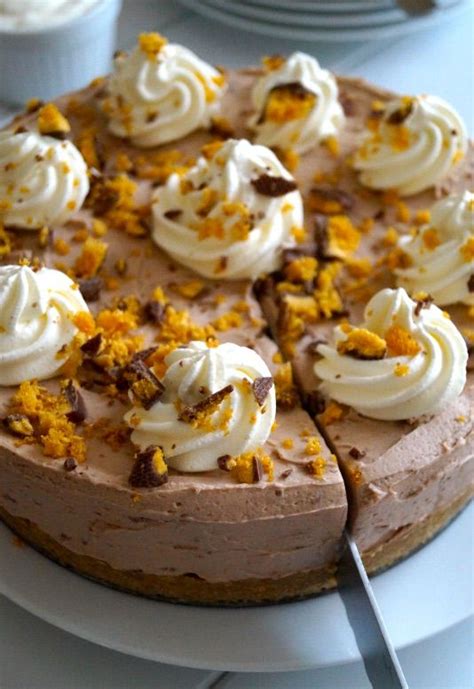 silky milk chocolate cheesecake speckled with crushed chocolate coated honeycomb pieces the