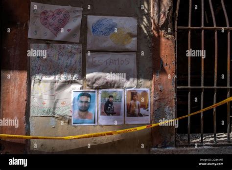 The portraits of the deceased are seen on the facade of the burned-out