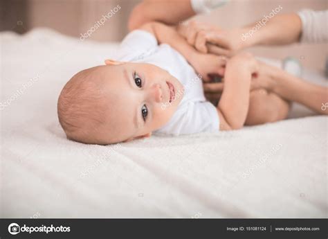 Cute Baby Boy On Bed — Stock Photo © Lenamiloslavskaya 151081124