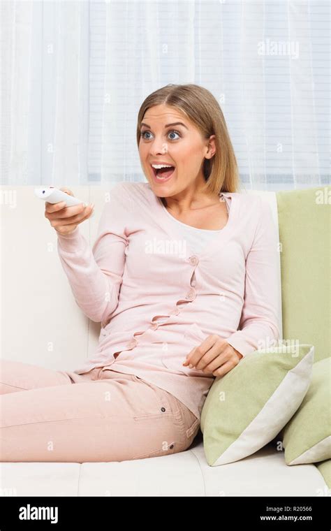 Surprised Woman Watching Tv Stock Photo Alamy