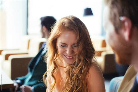 Ginger Woman Laughing In A Bar By Stocksy Contributor Lumina Stocksy