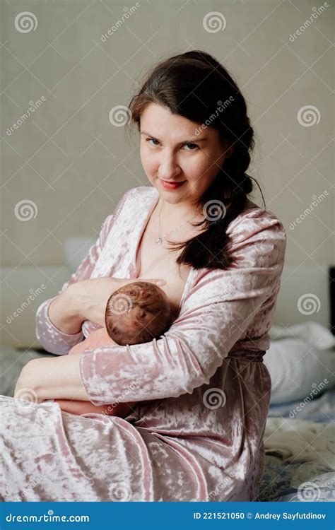 Mother Breastfeeds Newborn Baby Naturalness And Convenience Of