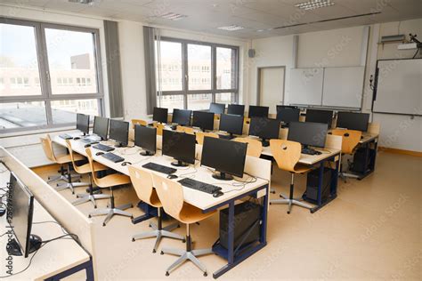 Computer Classroom With Monitors And Keyboards For Pupils And Students