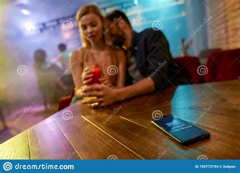 Unfaithful Man Spending Time With Another Woman Flirting In The Bar