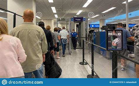 People Walking Through The Security Line At Orlando International