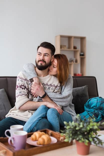 Free Photo Couple In Living Room Hugging