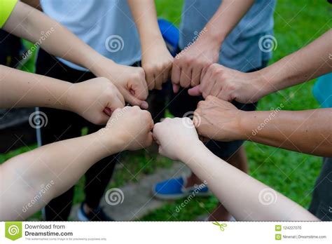 Hands Fist Join Together As Commitment Of Strong Team Work Stock Photo