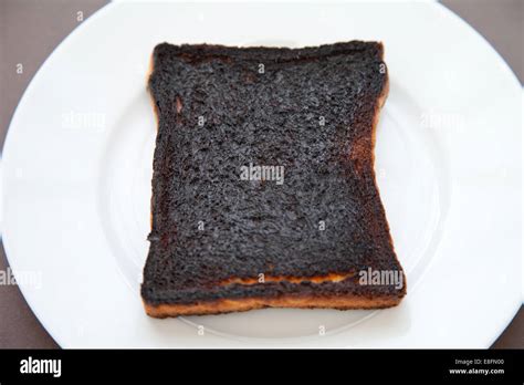 Close Up Of A Slice Of Burnt Toast On A Plate Stock Photo Alamy