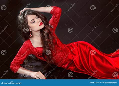 Woman In Red Lying In The Dark Fashion Tempting Girl Model In S Stock