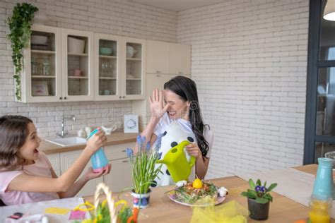 Brunette Woman And Her Pretty Daughter Having Fun In The Kitchen Stock Image Image Of Cheerful