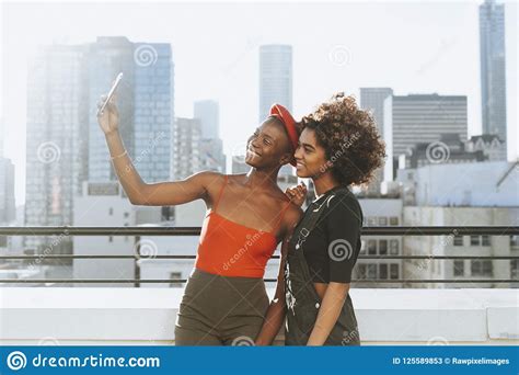 Girls Taking A Selfie At A Rooftop Stock Image Image Of Connection