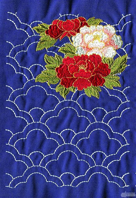 A Blue Cloth With Red And White Flowers On It