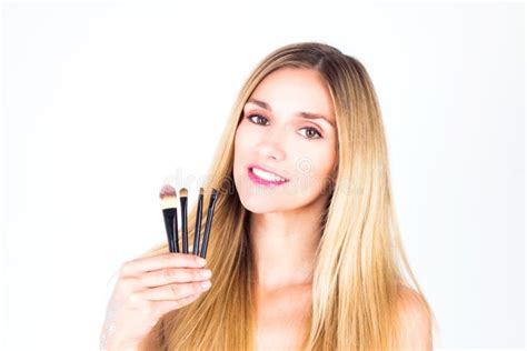 Happy Woman With Smile Is Holding Cosmetic Brushes Make Up Stock Photo